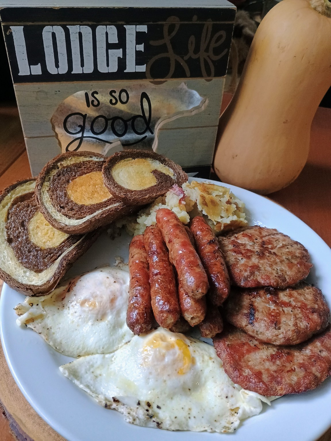 Our homemade breakfast with eggs, sausages, potatoes and toast